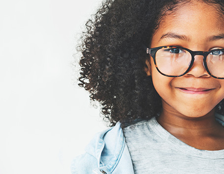 Smiling girl in glasses.